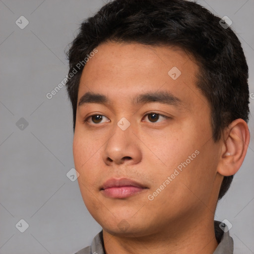 Neutral white young-adult male with short  black hair and brown eyes