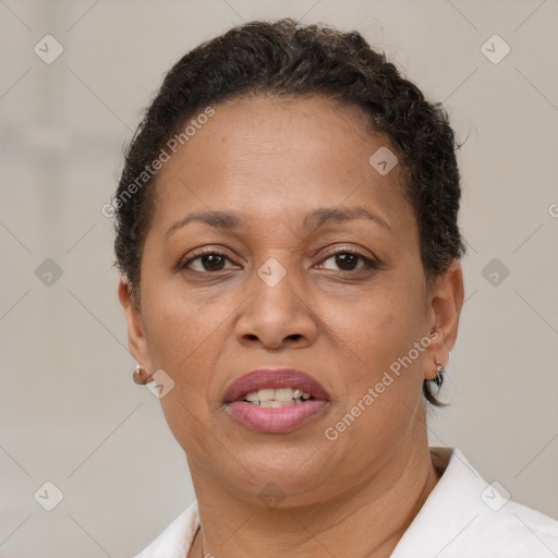 Joyful latino adult female with short  brown hair and brown eyes