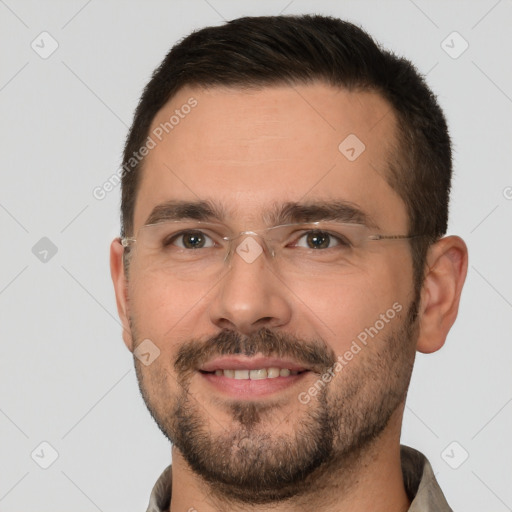 Joyful white adult male with short  brown hair and brown eyes