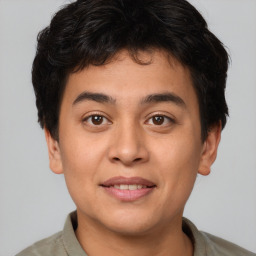 Joyful asian young-adult male with short  brown hair and brown eyes