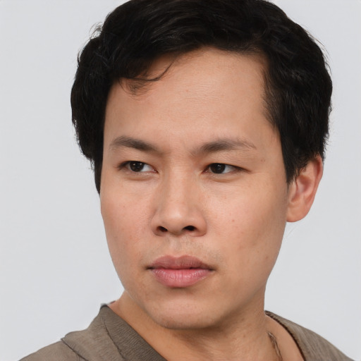 Neutral asian young-adult male with short  brown hair and brown eyes