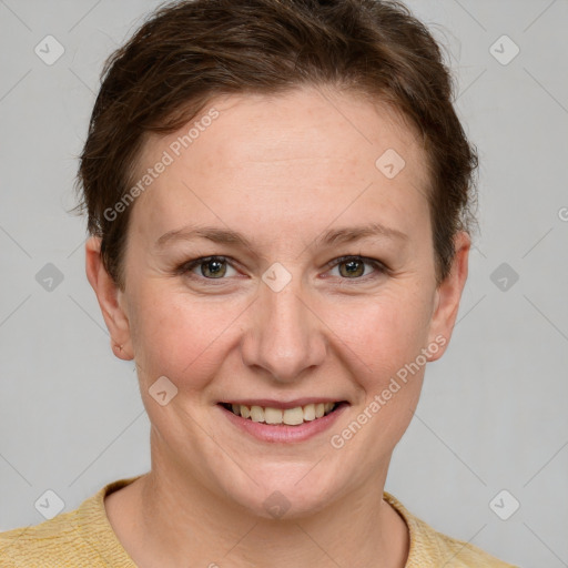 Joyful white young-adult female with short  brown hair and blue eyes