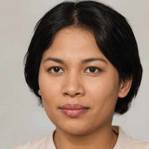 Neutral latino young-adult female with medium  black hair and brown eyes