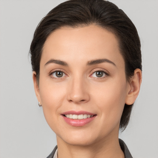 Joyful white young-adult female with medium  brown hair and brown eyes