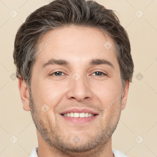 Joyful white adult male with short  brown hair and brown eyes