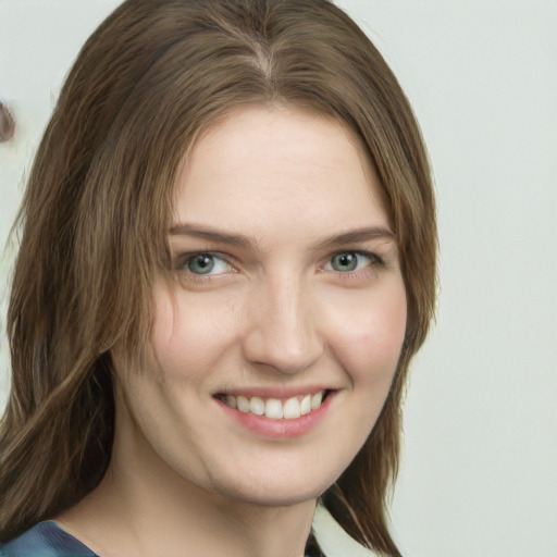 Joyful white young-adult female with medium  brown hair and green eyes