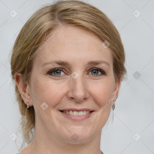 Joyful white adult female with medium  brown hair and grey eyes