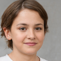 Joyful white child female with medium  brown hair and brown eyes