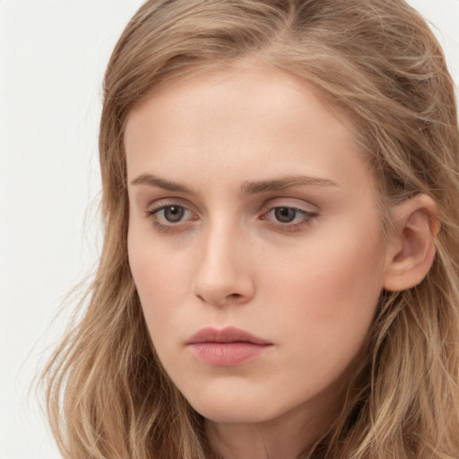 Neutral white young-adult female with long  brown hair and grey eyes