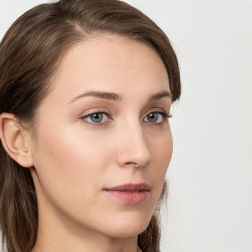 Neutral white young-adult female with long  brown hair and grey eyes