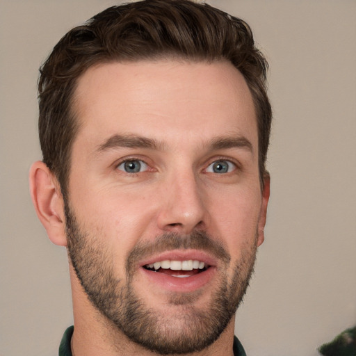 Joyful white young-adult male with short  brown hair and grey eyes