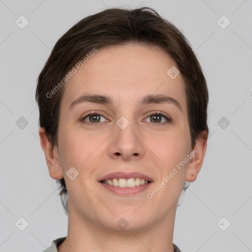 Joyful white young-adult female with short  brown hair and grey eyes