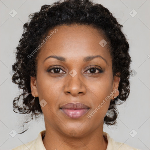 Joyful black adult female with medium  brown hair and brown eyes