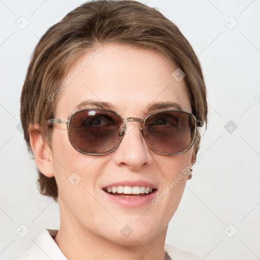 Joyful white young-adult female with medium  brown hair and blue eyes