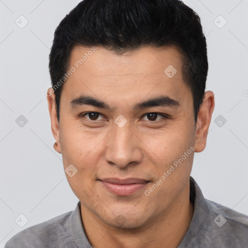 Joyful asian young-adult male with short  black hair and brown eyes