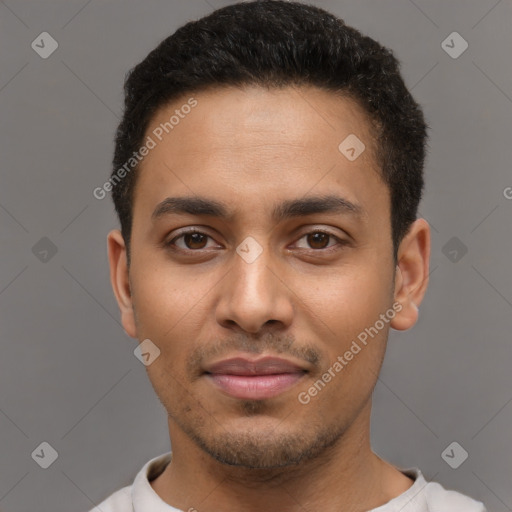 Joyful latino young-adult male with short  black hair and brown eyes