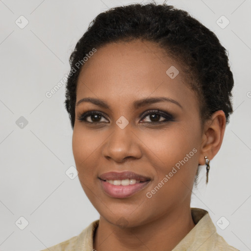 Joyful black young-adult female with short  brown hair and brown eyes