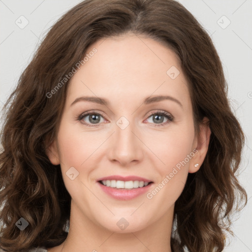 Joyful white young-adult female with long  brown hair and green eyes