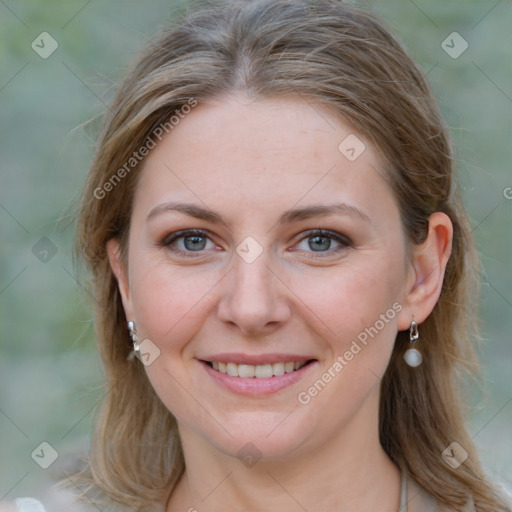 Joyful white young-adult female with medium  brown hair and blue eyes