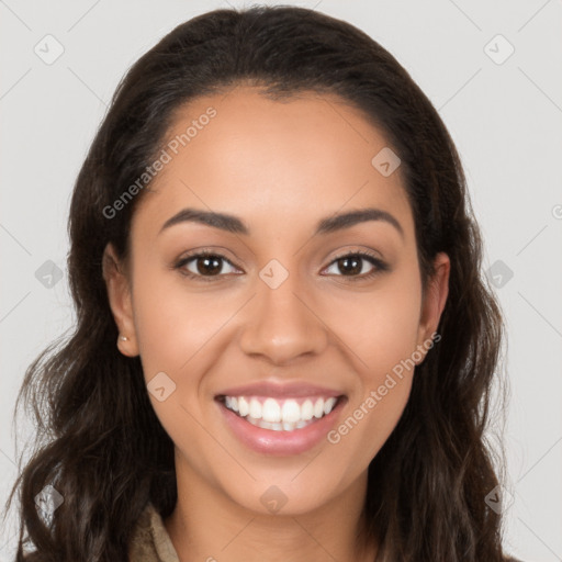 Joyful latino young-adult female with long  brown hair and brown eyes