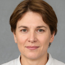 Joyful white adult female with short  brown hair and brown eyes