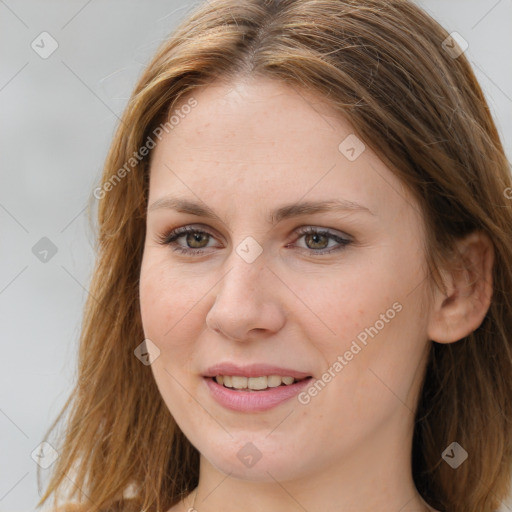 Joyful white young-adult female with long  brown hair and brown eyes