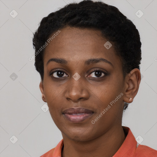 Joyful black young-adult female with short  black hair and brown eyes