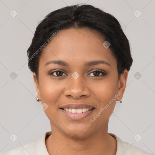 Joyful latino young-adult female with short  black hair and brown eyes