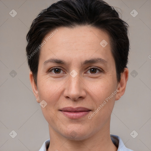 Joyful white adult female with short  brown hair and brown eyes