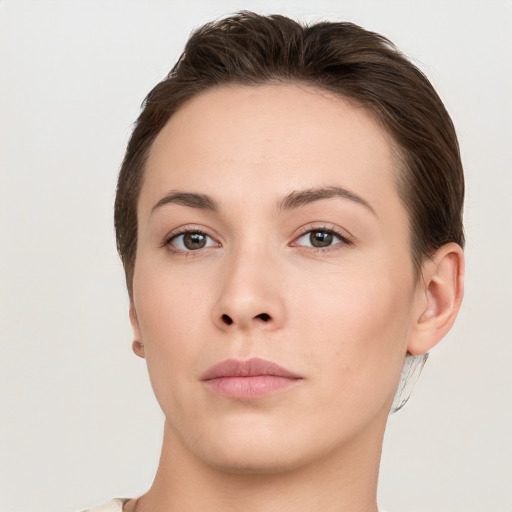 Neutral white young-adult female with short  brown hair and brown eyes