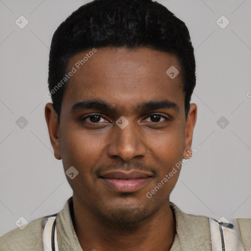 Joyful black young-adult male with short  black hair and brown eyes