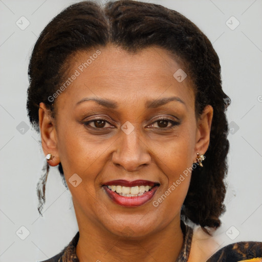 Joyful latino adult female with medium  brown hair and brown eyes