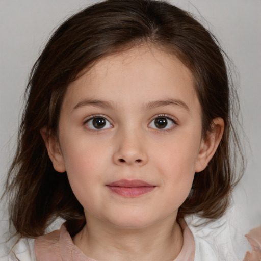 Joyful white child female with medium  brown hair and brown eyes