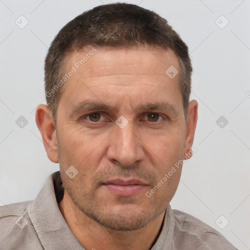 Joyful white adult male with short  brown hair and brown eyes