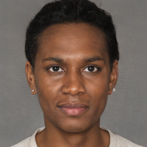 Joyful black young-adult male with short  black hair and brown eyes