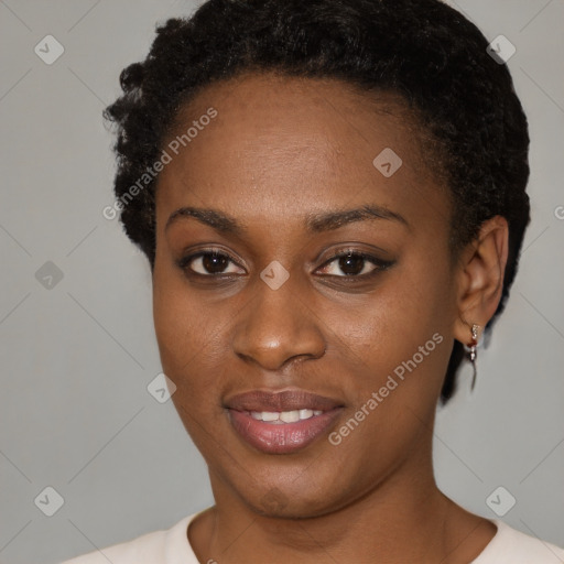 Joyful black young-adult female with short  brown hair and brown eyes