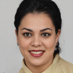 Joyful white young-adult female with medium  brown hair and brown eyes