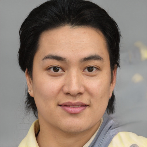 Joyful asian young-adult female with medium  brown hair and brown eyes