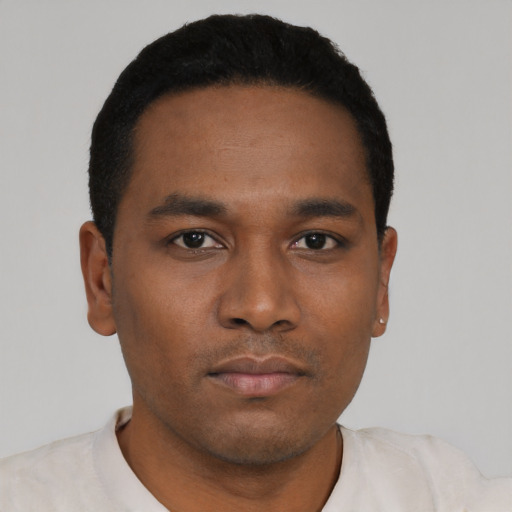 Neutral black young-adult male with short  black hair and brown eyes