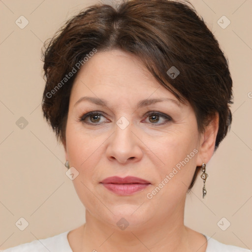 Joyful white adult female with short  brown hair and brown eyes