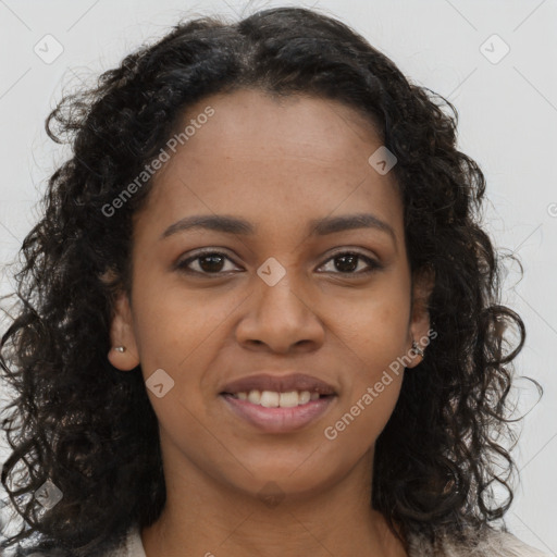 Joyful black young-adult female with long  brown hair and brown eyes