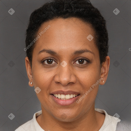 Joyful black adult female with short  brown hair and brown eyes