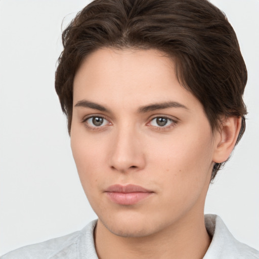 Neutral white young-adult female with short  brown hair and brown eyes