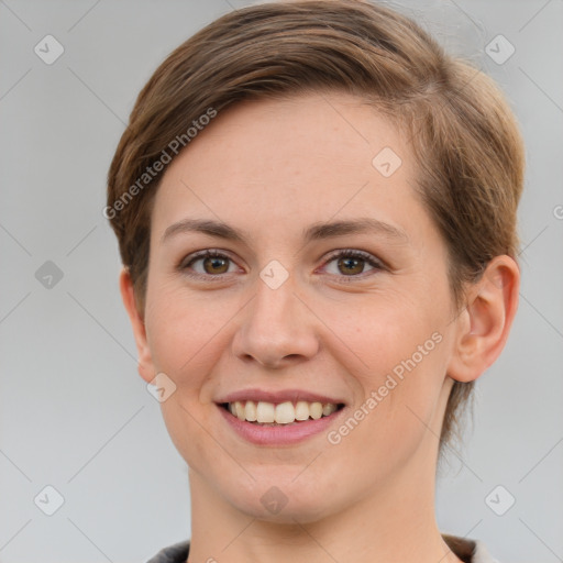 Joyful white young-adult female with short  brown hair and grey eyes