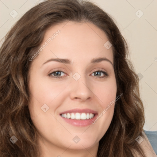 Joyful white young-adult female with long  brown hair and green eyes