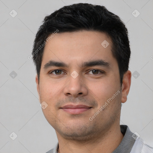 Joyful white young-adult male with short  black hair and brown eyes