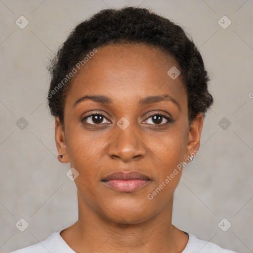 Joyful black young-adult female with short  black hair and brown eyes