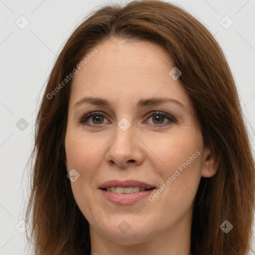 Joyful white adult female with long  brown hair and brown eyes