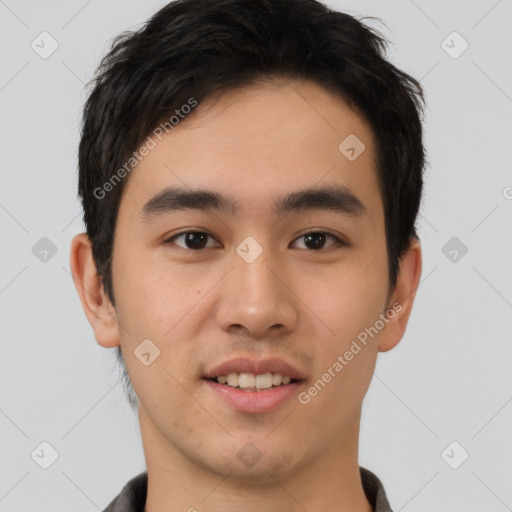 Joyful asian young-adult male with short  brown hair and brown eyes