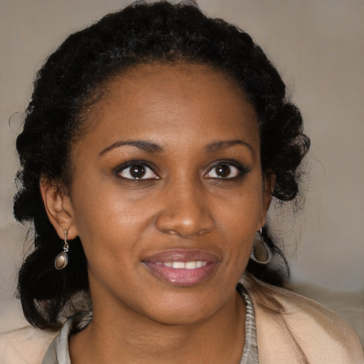 Joyful black young-adult female with medium  brown hair and brown eyes